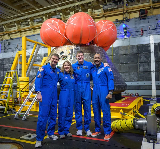 NASA astronauts Reid Wiseman, commander; left, Christina Koch, mission specialist; CSA (Canadian Space Agency) astronaut Jeremy Hansen, mission specialist; and NASA astronaut Victor Glover, Artemis II pilot, right, pose for a group photo after viewing the Orion spacecraft in the well deck of USS John P. Murtha, Saturday, April 11, 2026, in the Pacific Ocean off the coast of California. Credit: NASA/Bill Ingalls