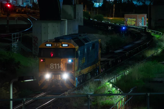 PACNAT loco 8114 shunts empty wagons out of Dynon