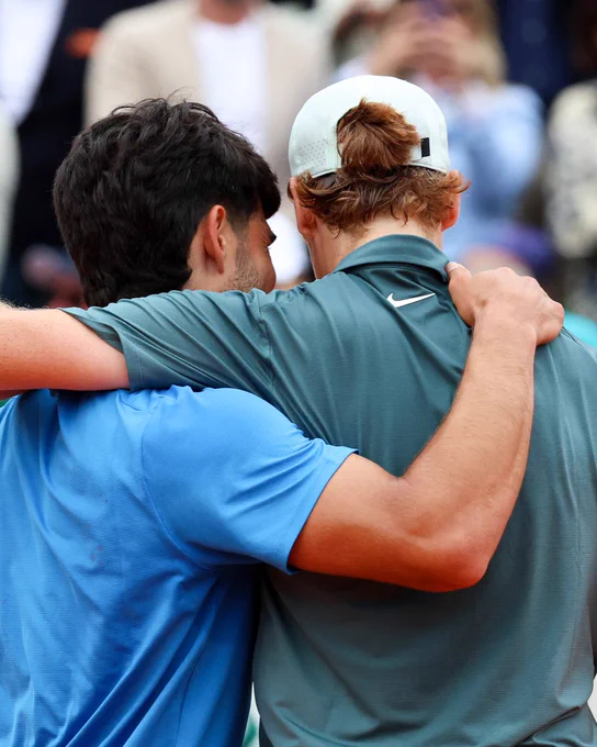 Carlos Alcaraz and Jannik Sinner embrace after their match in Monte Carlo