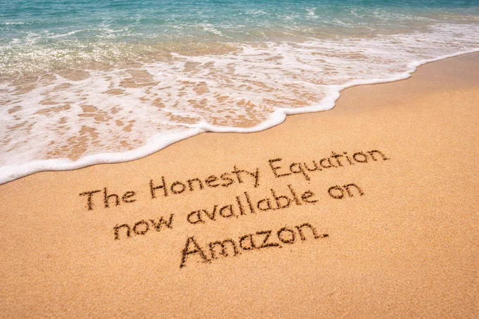 The Honesty Equation now available on Amazon written in the sand at the beach.