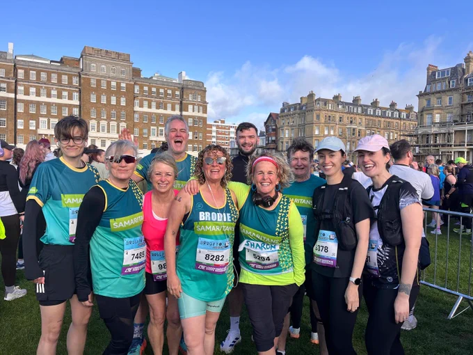 A photograph of 10 Samaritans volunteers smiling after the race.