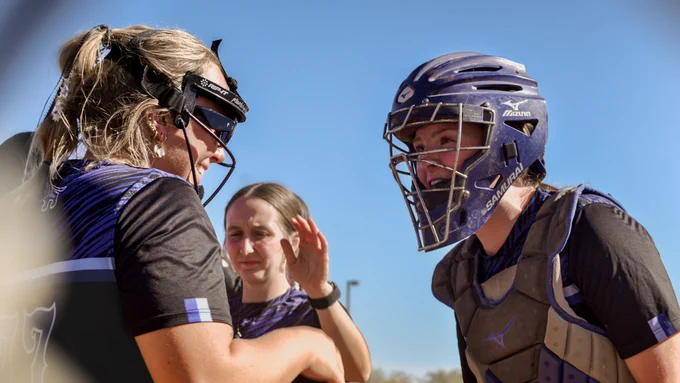 Jordyn Blogg and Mandalyn Nachtigall celebrating after a defensive play, photo by Kendra Meyer
