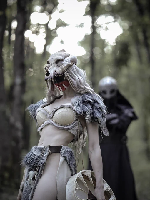 Asrunn and masked figure Mark of Eihwar in forest ritual scene