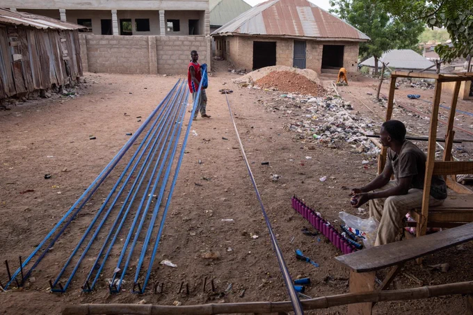 Some collaborate with graphic artists to develop innovative designs. [Toyin Adedokun/AFP]