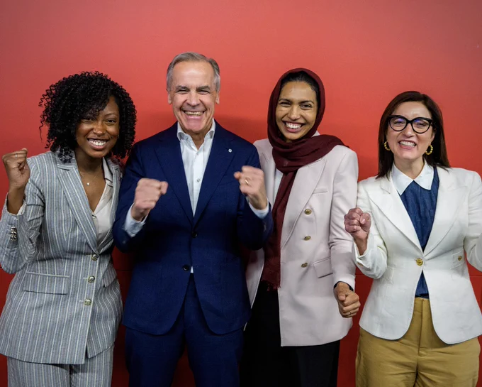 Prime Minister Carney poses for a photo with by-election candidates Tatiana Auguste, Doly Begum and Danielle Martin.