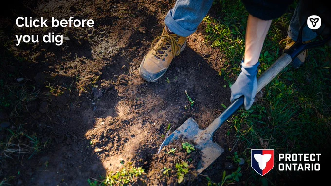 a shovel in the ground. Text: Click before you dig