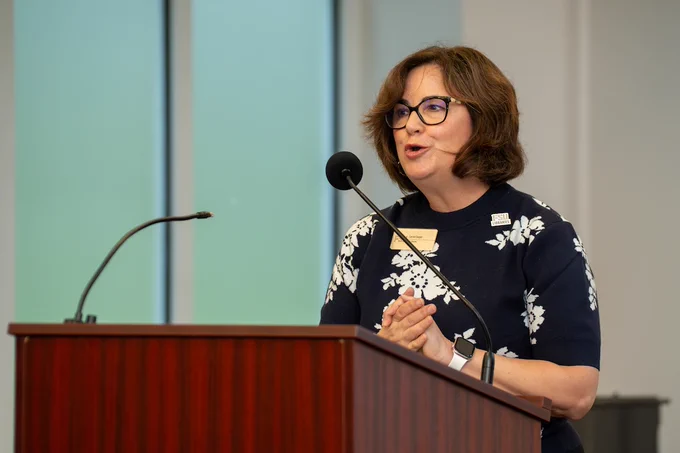 Dean of University Libraries Carrie Cooper speaks behind a podium.