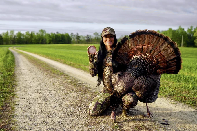 A hunter with a turkey.