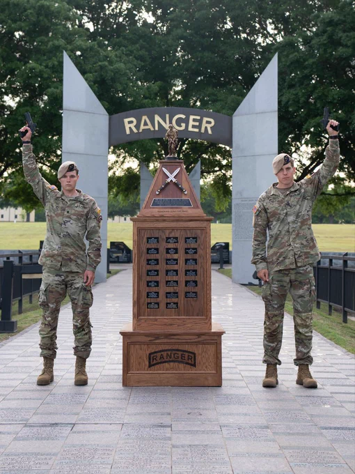  Sgt. Drew Schorsh and Spc. Caleb Godbold posing with the Best Ranger Trophy