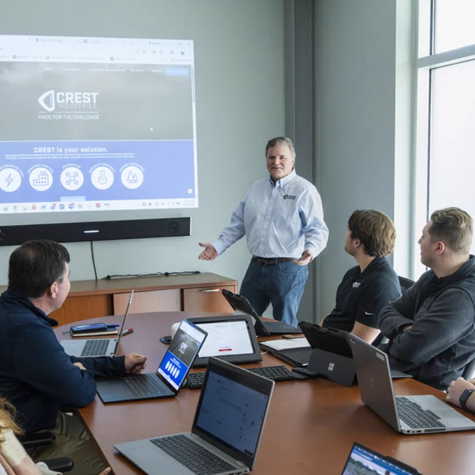 James Evans, chief information and systems officer, speaking to a group of employees in a conference room 