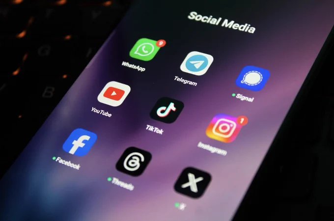 Social media app icons on a smartphone screen.