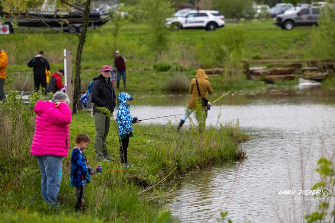 people fishing at pond