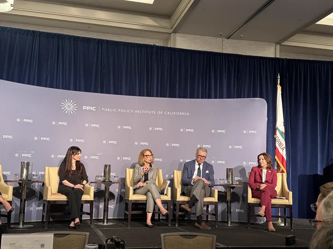 Five panelist sit onstage of a public policy Institute of California event.