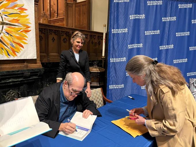 Colm Toibin signing a book