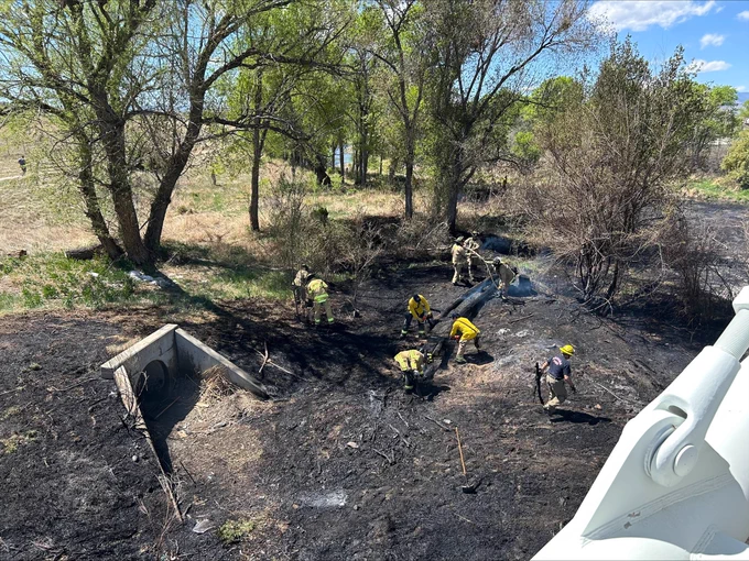 Firefighters work on mop-up operations, ensuring a vegetation fire is fully out. The fire took placed on Monday, April 13 in Gold Strike Park near Arvada.