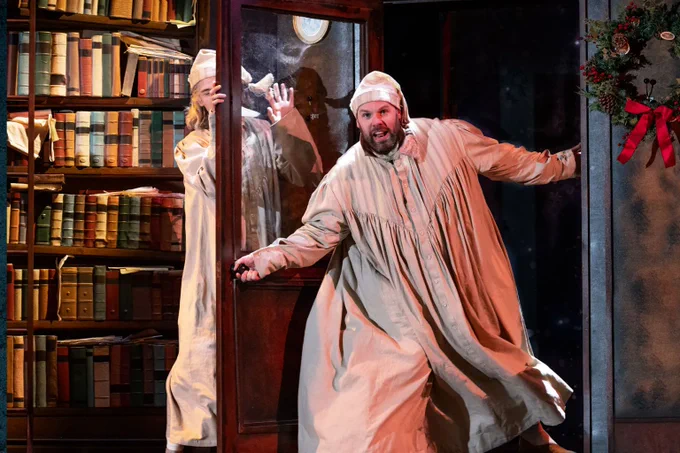 A photo showing two men in vintage nightgowns 