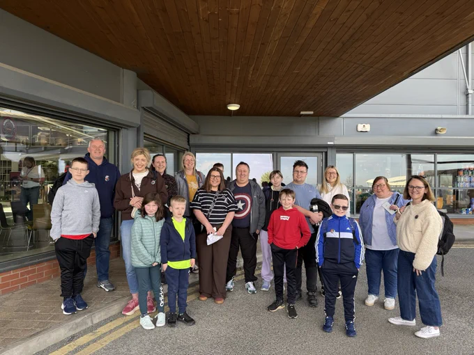 Ninjas (young people), mentors and families from CoderDojo Banbridge standing outside the Explorium building in Dublin