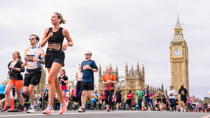 london marathon runners en-route with big ben pictured in the background