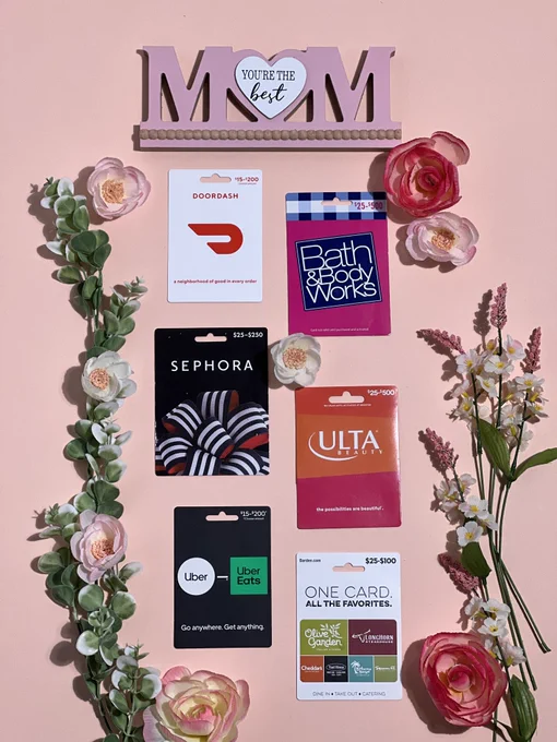 A collection of gift cards surrounded by florals and decorations on a pastel background.