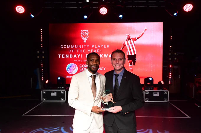Tendayi Darikwa with Martin Hickerton collecting Community Player of the Year.