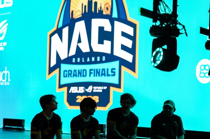 WVU Esports players sit on stage at the NACE Grand Finals.