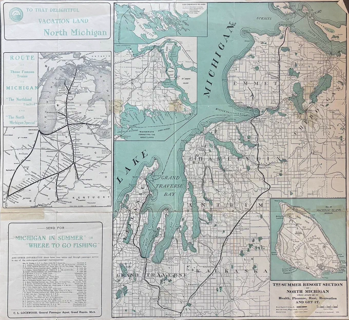 Blue and white map of Northern Michigan entitled "To That Delightful Vacation Land North Michigan." It shows train routes, fishing locations, a close-up of Mackinac Island, and the towns of the region.
