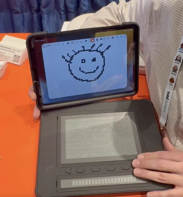 screenshot of a smile face being projected on DOT pad
