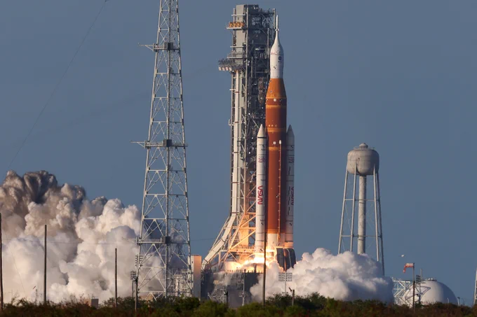 NASA's SLS rocket launches from NASA Kennedy. Smoke is seen beginning to form as the boosters ignite. Credit: NASA/Michael DeMocker