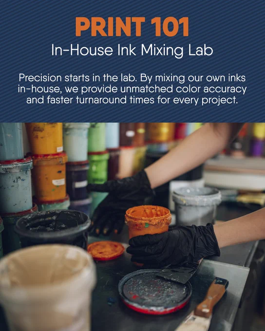 In-house ink mixing lab: gloved hands handling open ink jars and tools, highlighting precise color mixing.