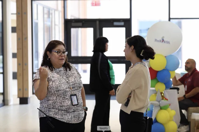 Two women talking at the Welcome to Kinder event