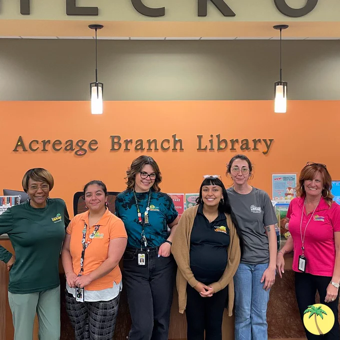 Acreage Branch library staff in library shirts.
