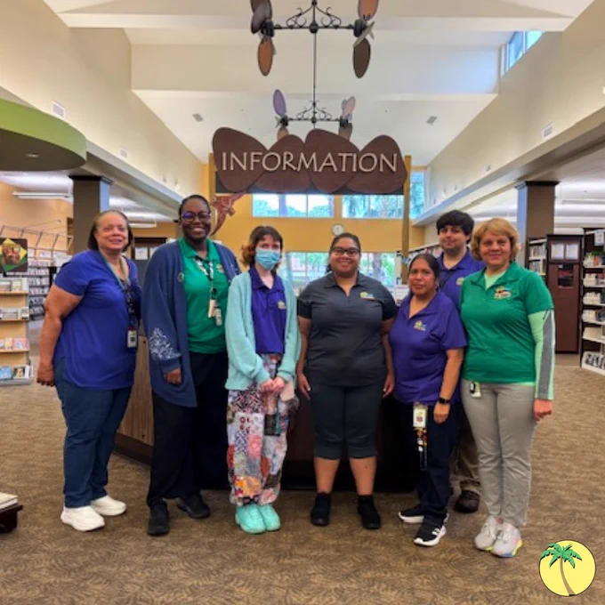 Royal Palm Beach branch staff in library shirts.