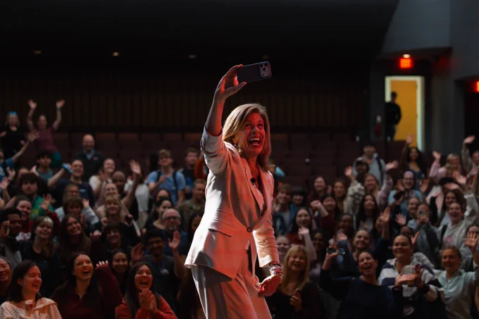Hoda Kotb takes a selfie with a packed Virginia Tech auditorium.
