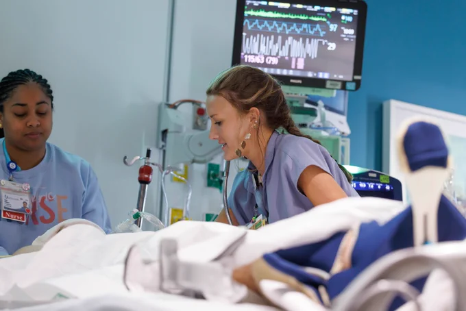 Registered Nurses Tiana Williams and Alexis Gaines take care of a patient in the PICU. The PICU has been awarded the Pediatric Nurse Excellence Diamond Award, the highest distinction presented by the Society of Pediatric Nurses.