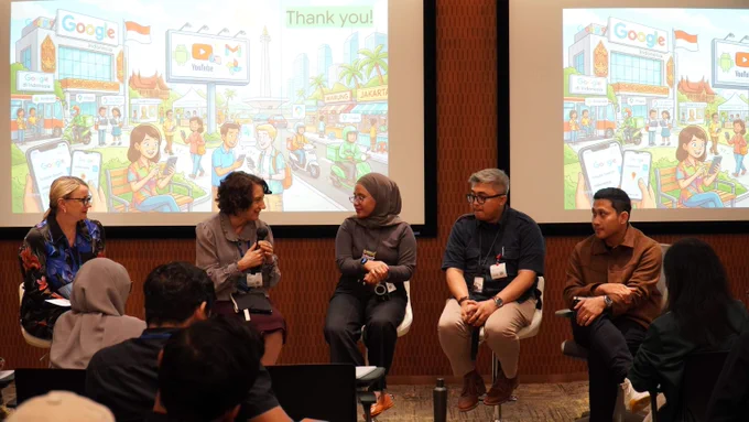 Panel discussion with integrety experts seated on stage in front of a colorful themed presentation slide showing diverse cityscape and technology icons.