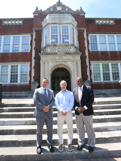 Superintendent Dr. Mike Daria, TCS Board Chair Eric Wilson and Andre Harrison, Cognia’s deputy chief of accreditation services.