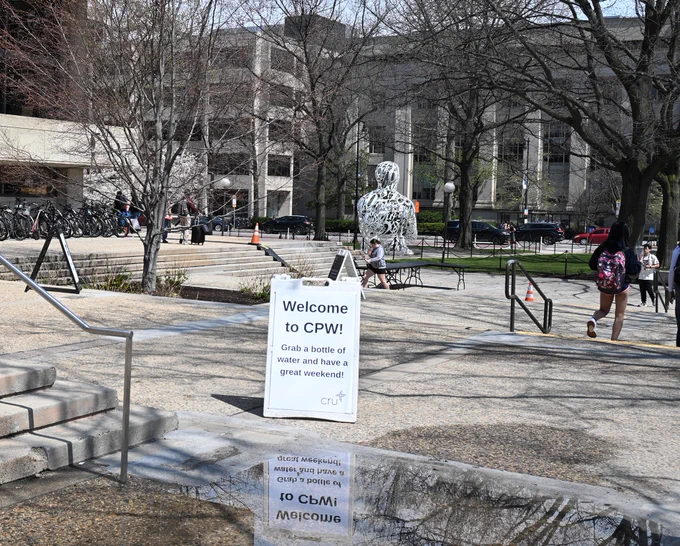 CPW sign reflecting in a puddle in front of the Student Center