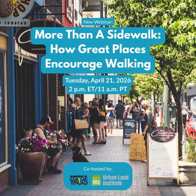 people walking on a sidewalk