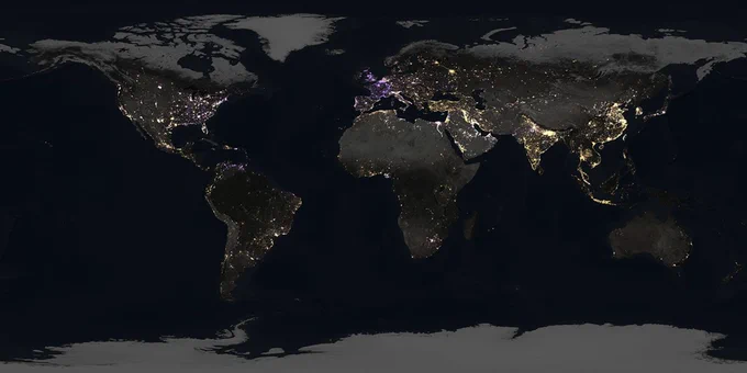Map showing how nighttime light on Earth changed from 2014 to 2022. Gold areas indicate brighter nighttime lights. Purple areas indicate dimmer nighttime lights. White areas indicate a mix of brightening and dimming. The United States has gold areas on the west and more purple and white on the east. Europe is mostly purple. China, India, the Middle East, and Central America are mostly gold. There is a bright gold chain of lights stretching across the South Pacific toward Australia.