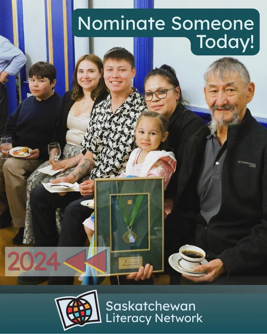This picture is of Allen Claude Janvier, sitting and smiling with five of his family members at the reception in the ballroom of Government House for the Saskatchewan Literacy Awards of Merit in 2024. Allan is holding the framed Award of Merit he received for the Cameco Literacy Learner Award and Bursary. The caption reads 'Nominate Someone Today!' and the post is from the Saskatchewan Literacy Network. The Network logo is in the lower middle section and has a stylized book with a stylized globe in front of it, symbolizing the world of opportunities that are possible through literacy and learning. www.saskliteracy.ca  