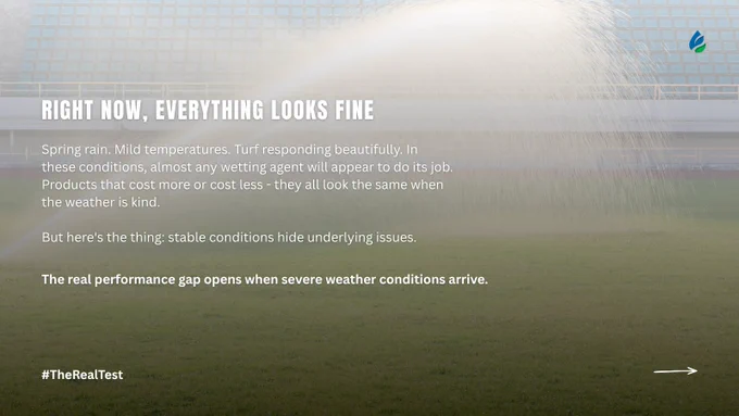 A sports field with an empty stadium in the background. Text on the image reads: "Right now, everything looks fine. Spring rain. Mild temperatures. Turf responding beautifully. In these conditions, almost any wetting agent will appear to do its job. Products that cost more or cost less - they all look the same when the weather is kind. But here’s the thing: stable conditions hide underlying issues. The real performance gap opens when severe weather conditions arrive. #TheRealTest." There is a logo in the top right corner.
