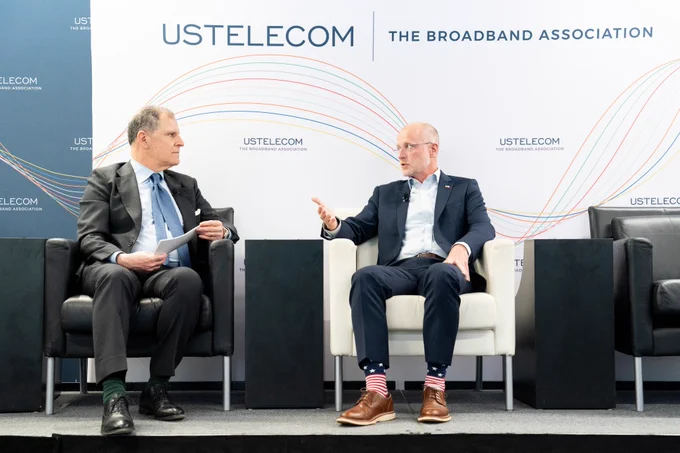 Image of USTelecom President and CEO Jonathan Spalter and FCC Chairman Brendan Carr speaking at USTelecom's American Connectivity Forum