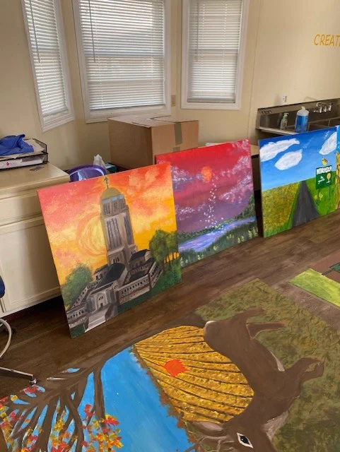 Completed murals drying before being installed at Kids Kingdom