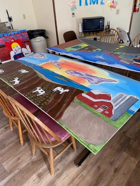 Completed murals drying before being installed at Kids Kingdom