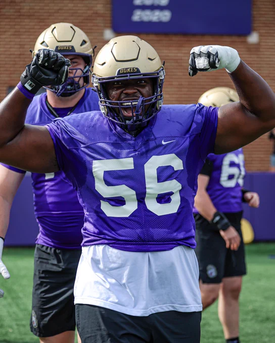 Tyler Brown flexes for the camera at Thursday's spring practice.