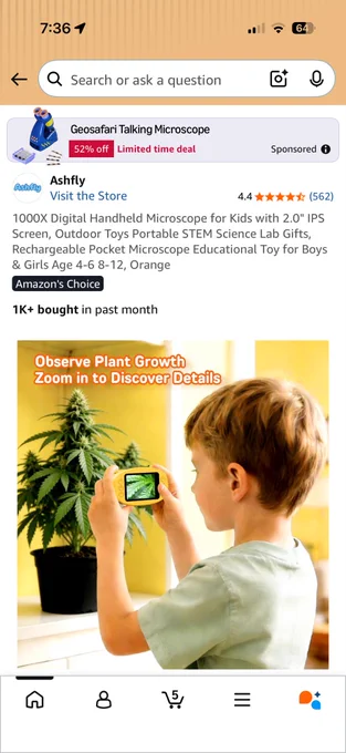 Actual product image of a child using the handheld microscope to look at a budding cannabis plant