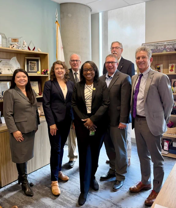 Members of the Megaregion Working Group standing with state Assemblymember Rhodesia Ransom in Sacramento.
