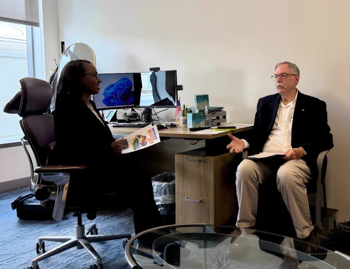 Assemblymember Rhodesia Ransom and SJCOG Boardmember Leo Zuber discuss the Megaregion Dozen projects in an office.