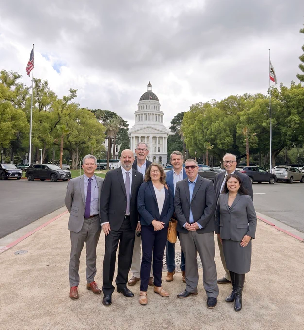 Members of the Megaregion Working Group standing in front of the state Capitol in Sacramento.