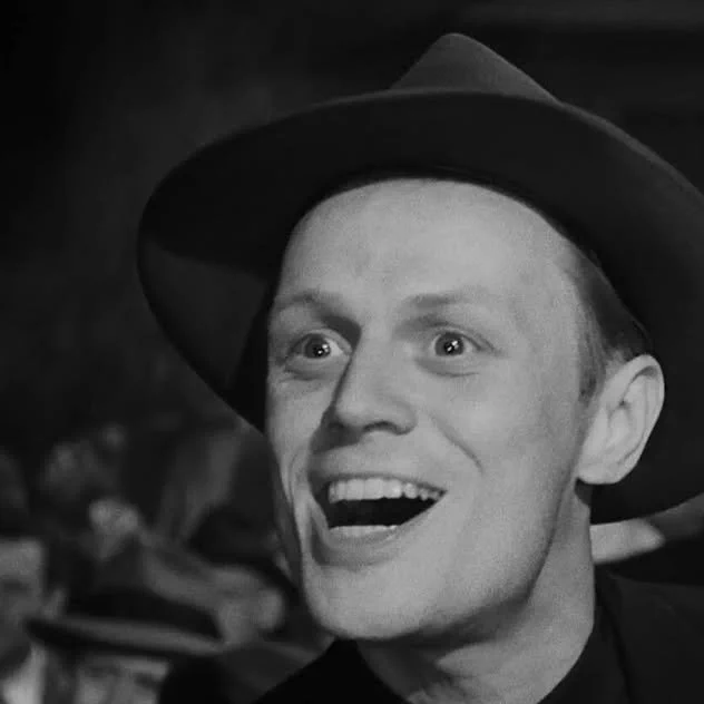 Richard Widmark as Tommy Udo in 1947's film noir classic 'Kiss Of Death' - coldhearted villain with a colorful and deeply twisted sense of humor.